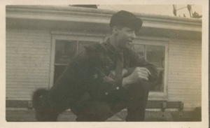 Image of Donald B. MacMillan with pup on deck of S.S. Roosevelt